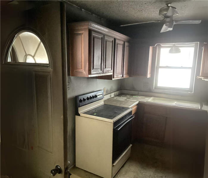 Soot covered kitchen after a fire