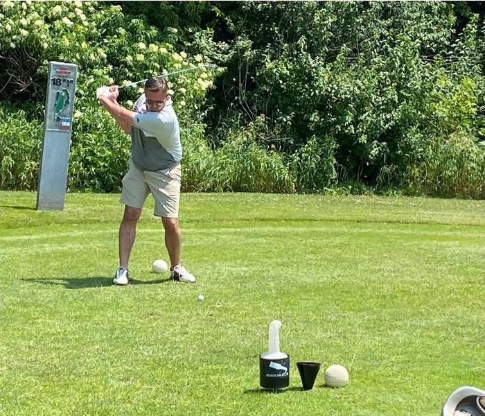 Our owner, Scott Demuth, golfing in the event